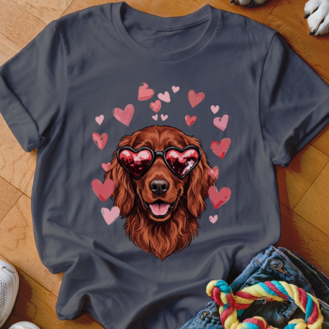 A dark gray t-shirt featuring an illustration of an Irish Setter wearing heart-shaped sunglasses surrounded by pink hearts.
