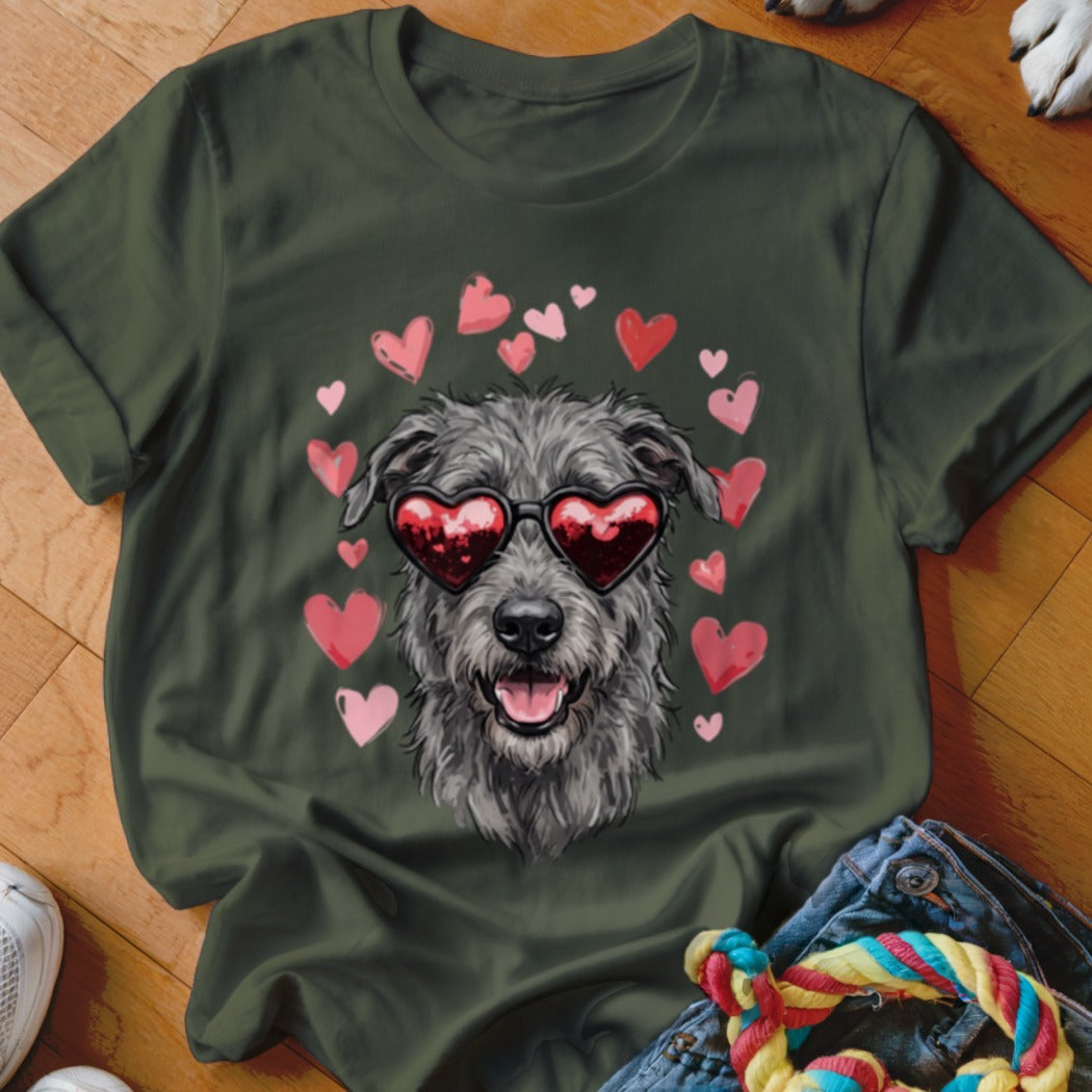 Dark green t-shirt featuring a graphic of a scruffy grey dog wearing heart sunglasses surrounded by pink hearts.