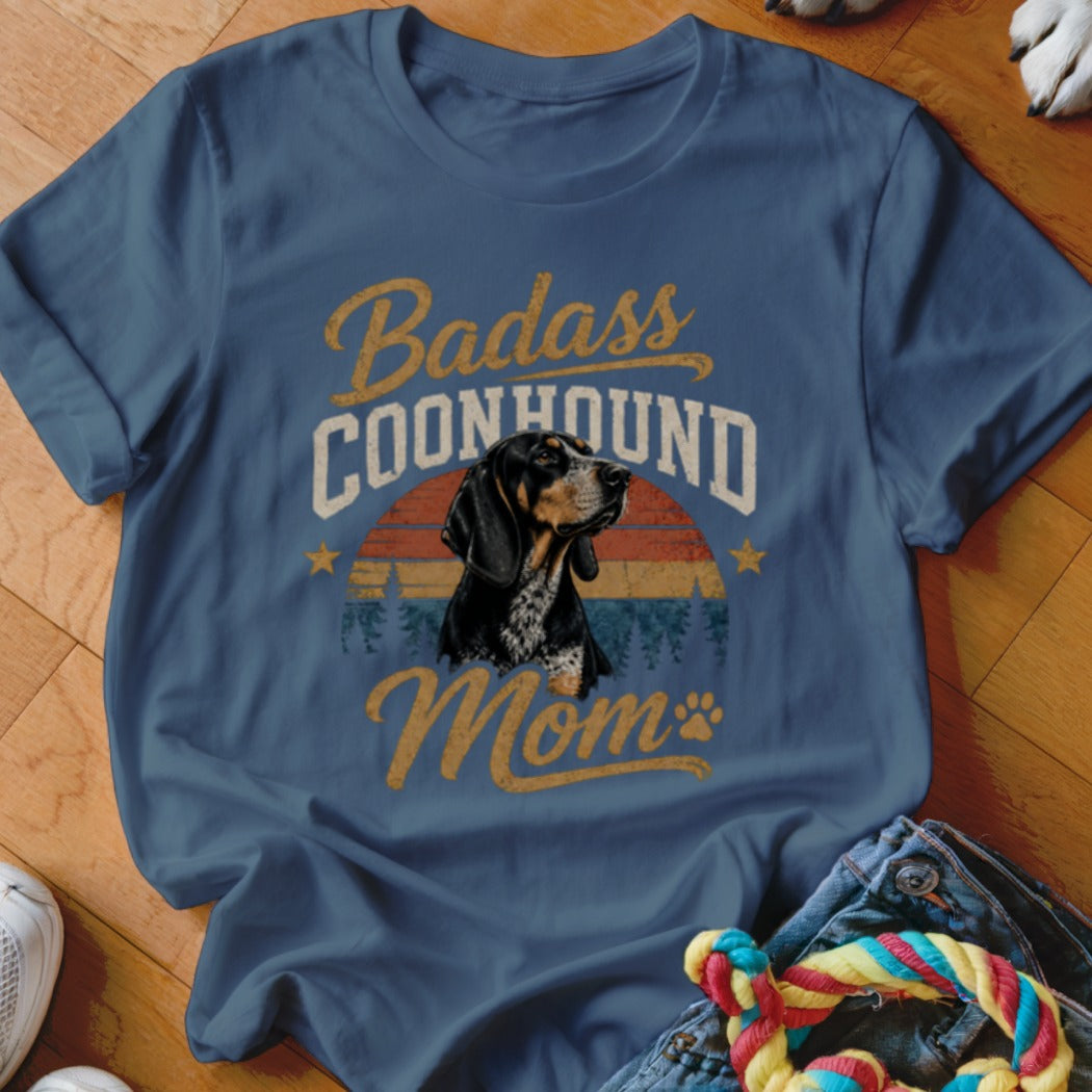 Badass Coonhound Mom graphic on a blue t-shirt with dog portrait.