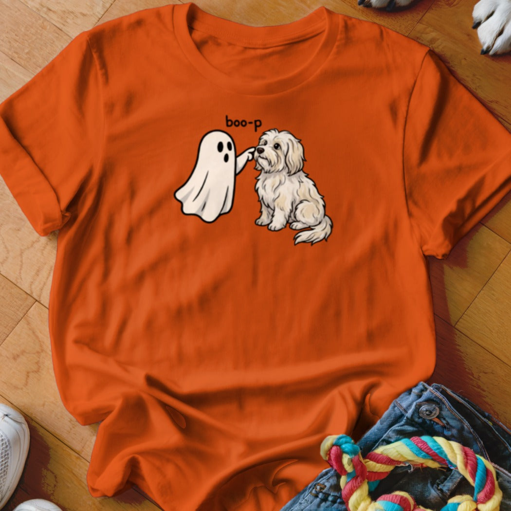 Ghost booping a white dog with text "boo-p" on an orange t-shirt.