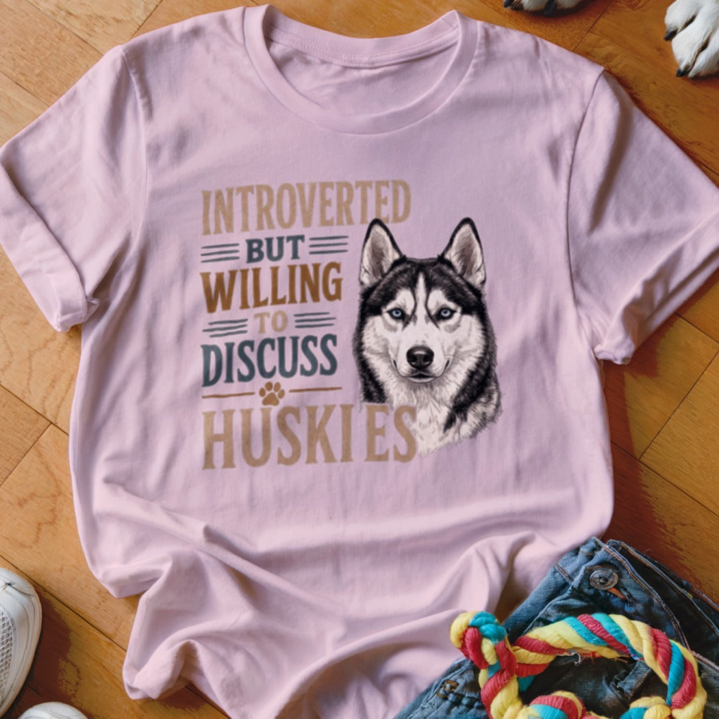 Pink t-shirt with a husky and text "Introverted but willing to discuss huskies".