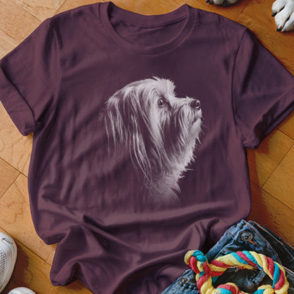 Maroon t-shirt with a white, textured portrait of a fluffy dog looking up.