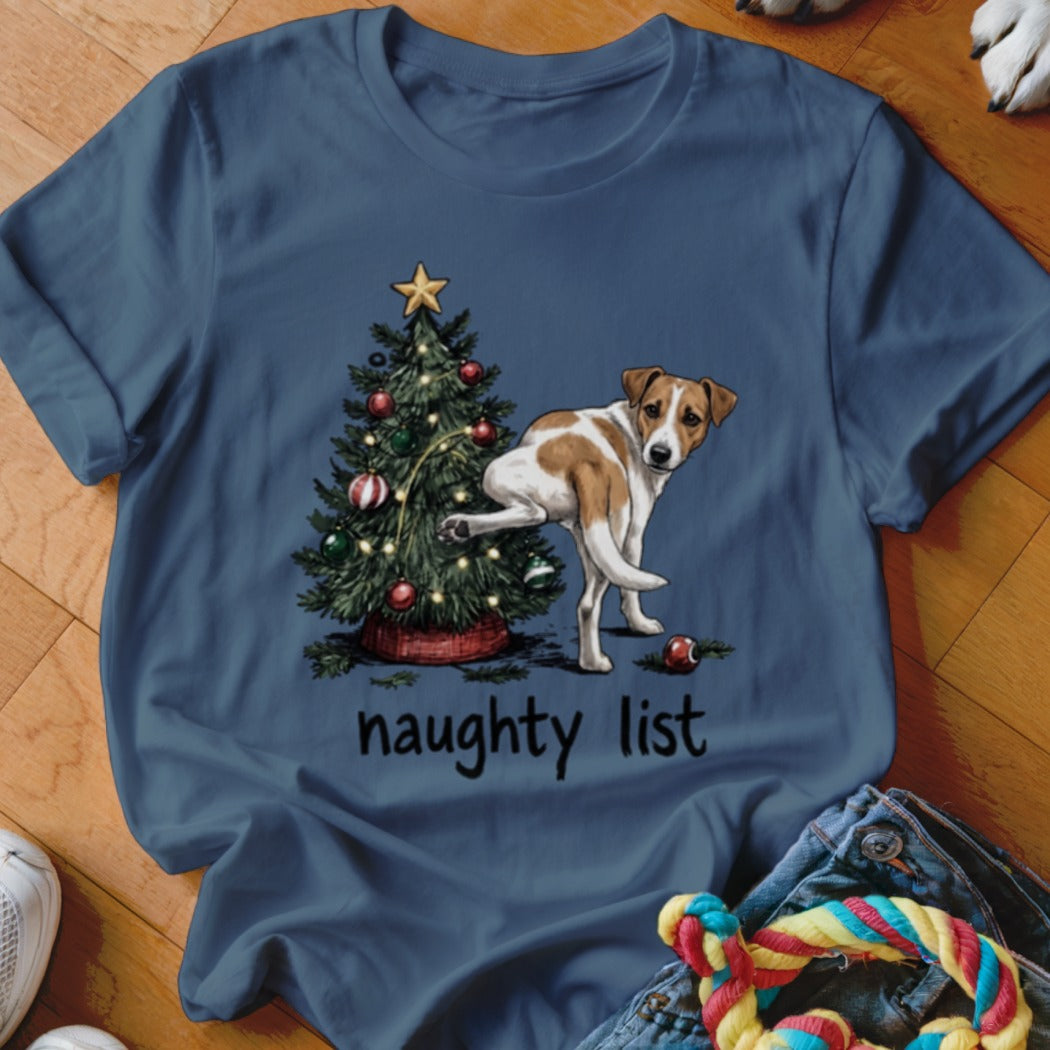 Dog lifting leg on Christmas tree with "naughty list" text.
