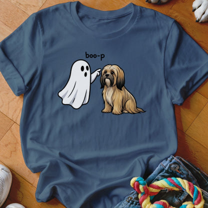 Cartoon ghost "boop-ing" a fluffy dog on a blue t-shirt.