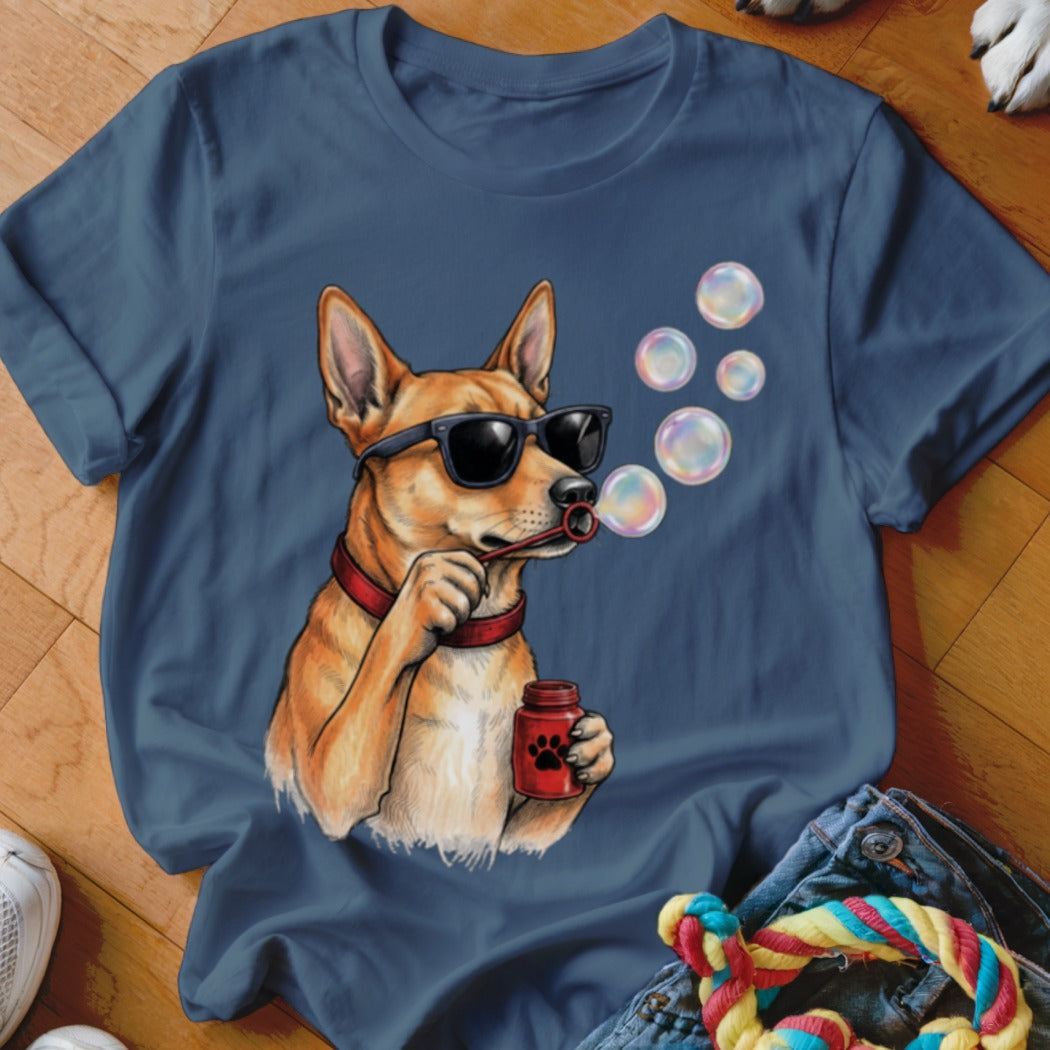 A dark blue t-shirt featuring an illustration of a dog wearing sunglasses and blowing bubbles.