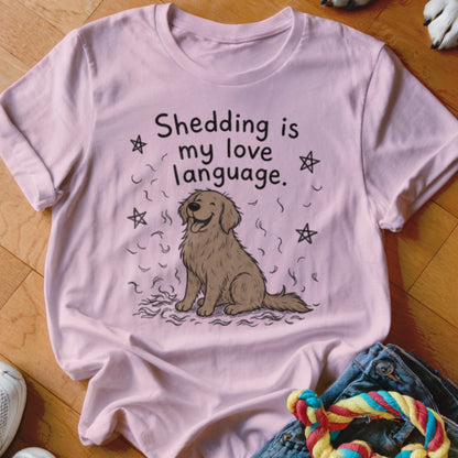 Pink t-shirt with a cartoon dog and the text "Shedding is my love language."