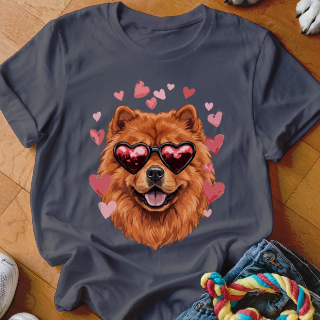 A dark gray t-shirt featuring a graphic of a fluffy Chow Chow wearing heart-shaped sunglasses surrounded by pink hearts.