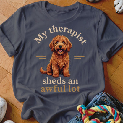 T-shirt with a fluffy dog illustration and text "My therapist sheds an awful lot".