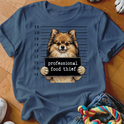 Pomeranian dog holding a "professional food thief" sign with a police lineup background.