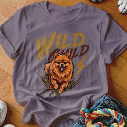 A purple t-shirt featuring a graphic of a Pomeranian dog running beneath the text Wild Child.