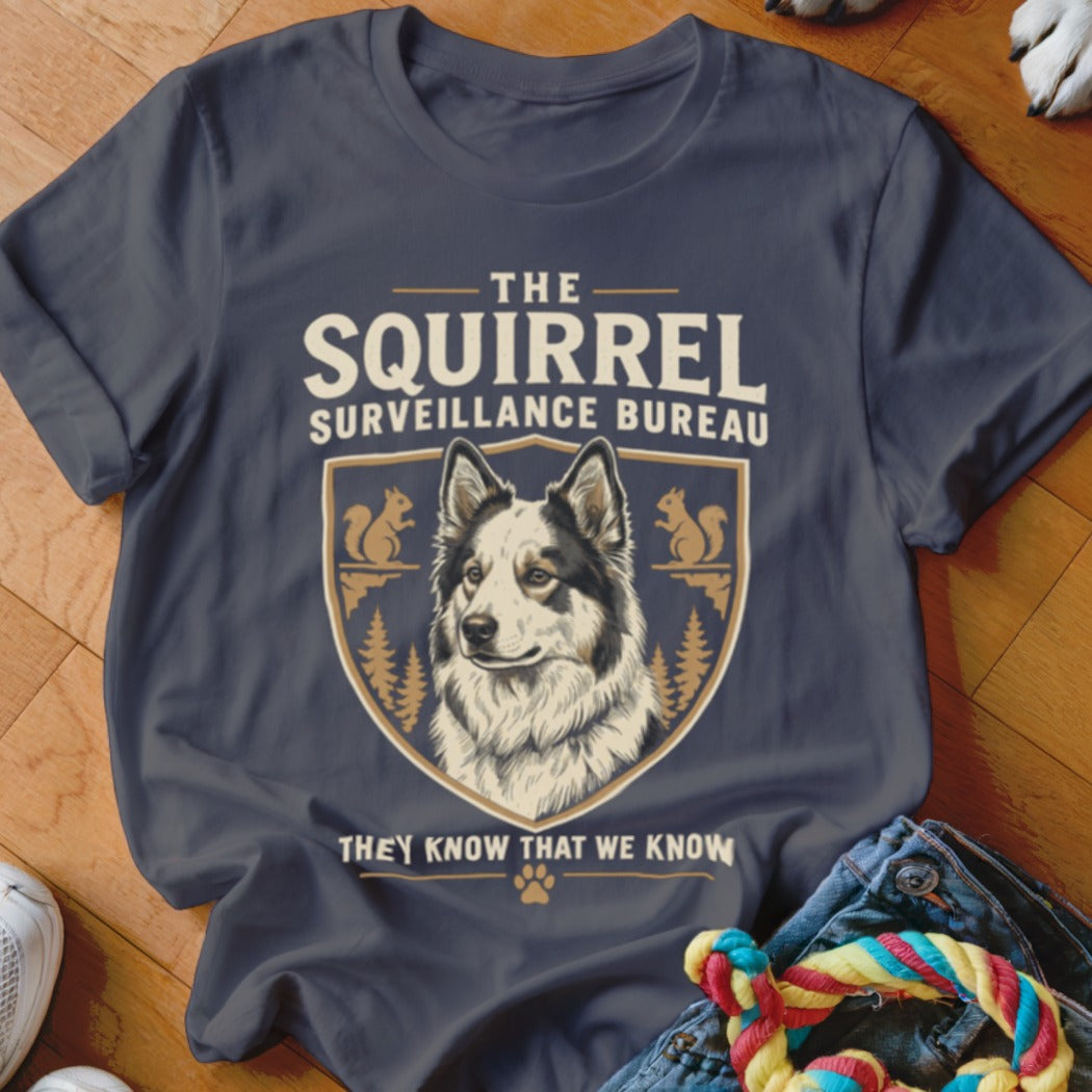 Charcoal t-shirt featuring a dog graphic, crest, squirrels, and the text The Squirrel Surveillance Bureau.