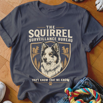 Charcoal t-shirt featuring a dog graphic, crest, squirrels, and the text The Squirrel Surveillance Bureau.