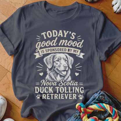 T-shirt with text "Today's good mood is sponsored by my Nova Scotia Duck Tolling Retriever" and dog illustration.
