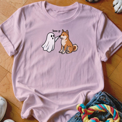 Pink t-shirt with ghost playfully booping a Shiba Inu dog.