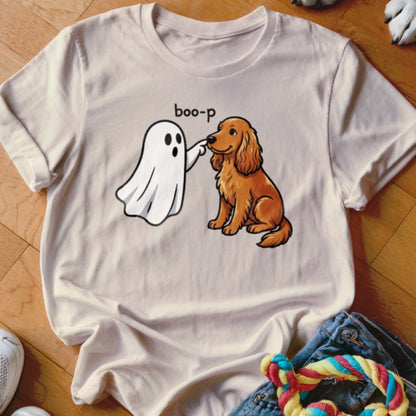 White t-shirt with illustration of a ghost booping a golden retriever, text says "boo-p".