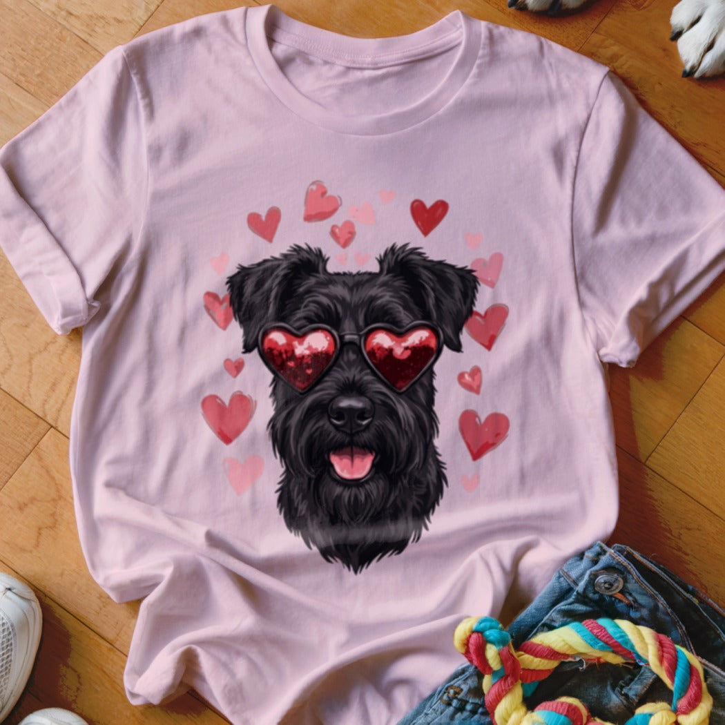 Pink t-shirt featuring a black schnauzer wearing heart-shaped sunglasses surrounded by floating pink hearts.