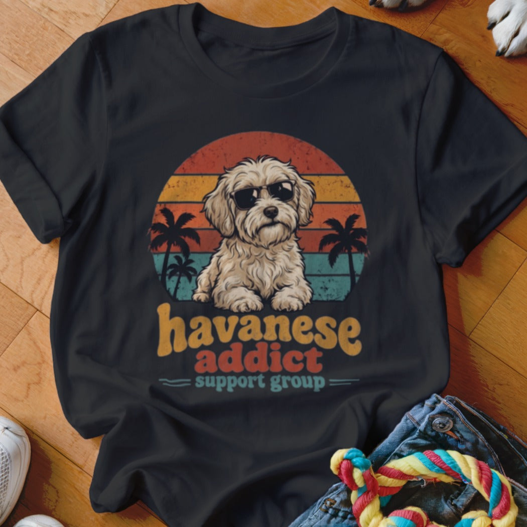 Black t-shirt featuring a retro sunset graphic, a Havanese dog wearing sunglasses, and the text Havanese addict support group.