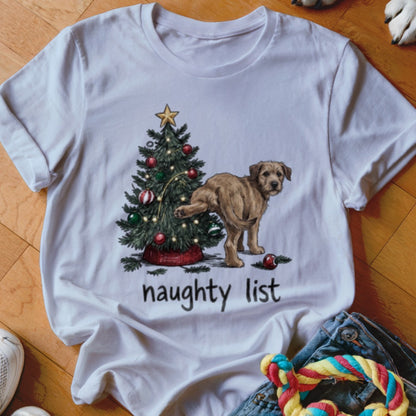 White t-shirt with a graphic of a dog peeing on a Christmas tree above the text "naughty list".