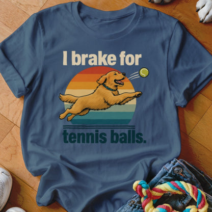 Golden retriever jumping for a tennis ball with text "I brake for tennis balls."