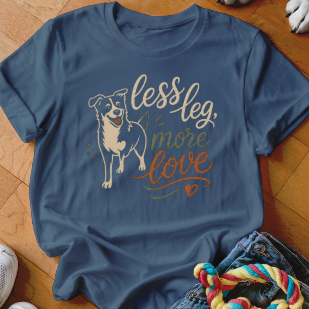 Blue t-shirt with illustration of a dog and text "less leg, more love".