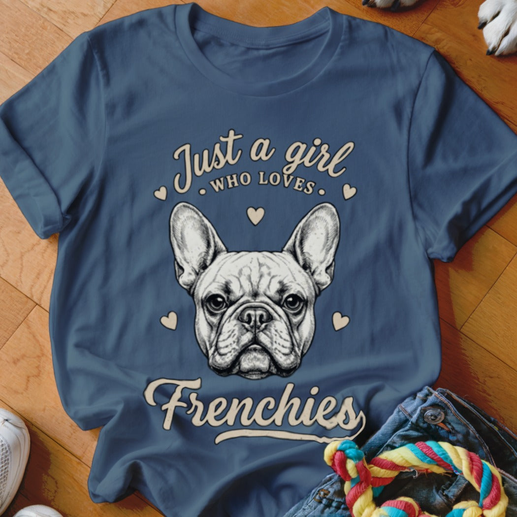 Blue t-shirt featuring a French bulldog illustration and text that reads Just a girl who loves Frenchies.