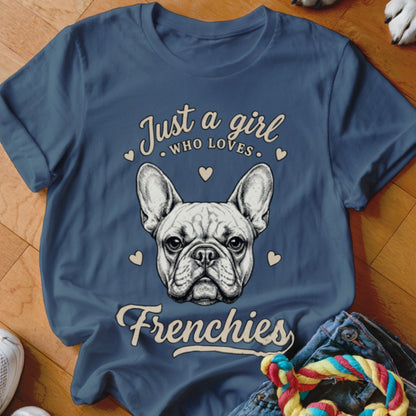 Blue t-shirt featuring a French bulldog illustration and text that reads Just a girl who loves Frenchies.