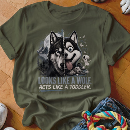 Green t-shirt with husky illustration, half wolf, half goofy dog with text LOOKS LIKE A WOLF. ACTS LIKE A TODDLER.