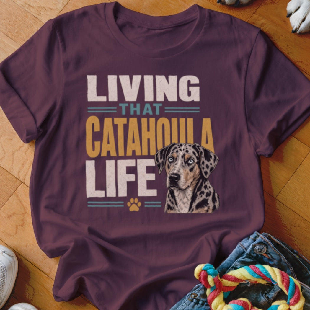 Catahoula leopard dog graphic on a maroon t-shirt with text "Living That Catahoula Life".
