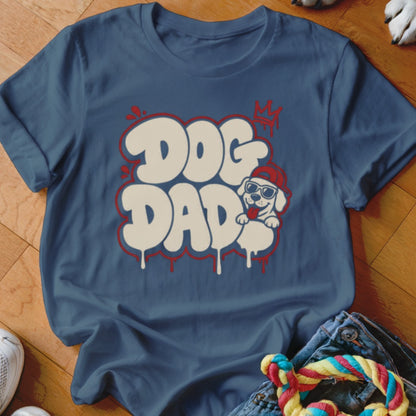 Blue t-shirt with white "DOG DAD" bubble text and a cartoon dog.