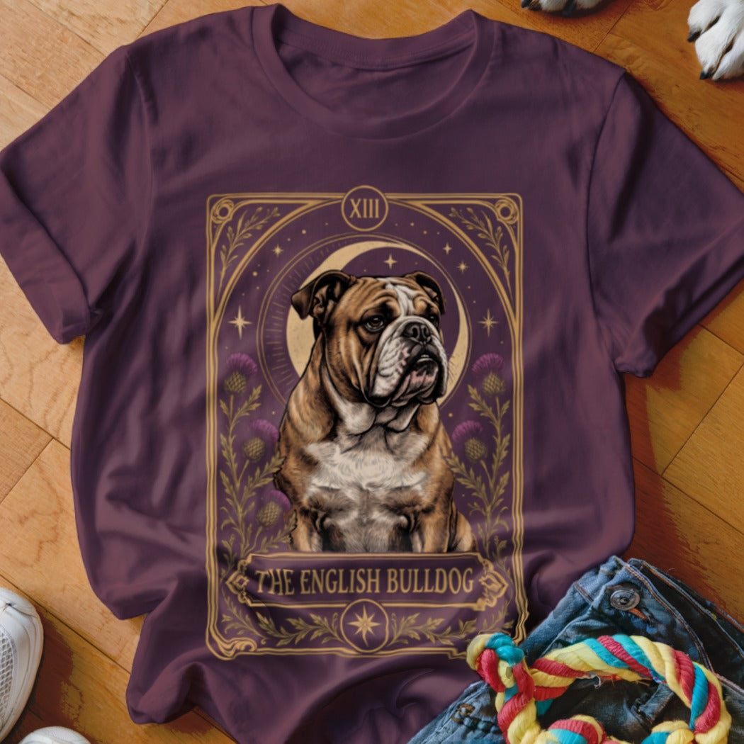 Purple t-shirt featuring a tarot card style graphic of an English Bulldog surrounded by purple thistles.