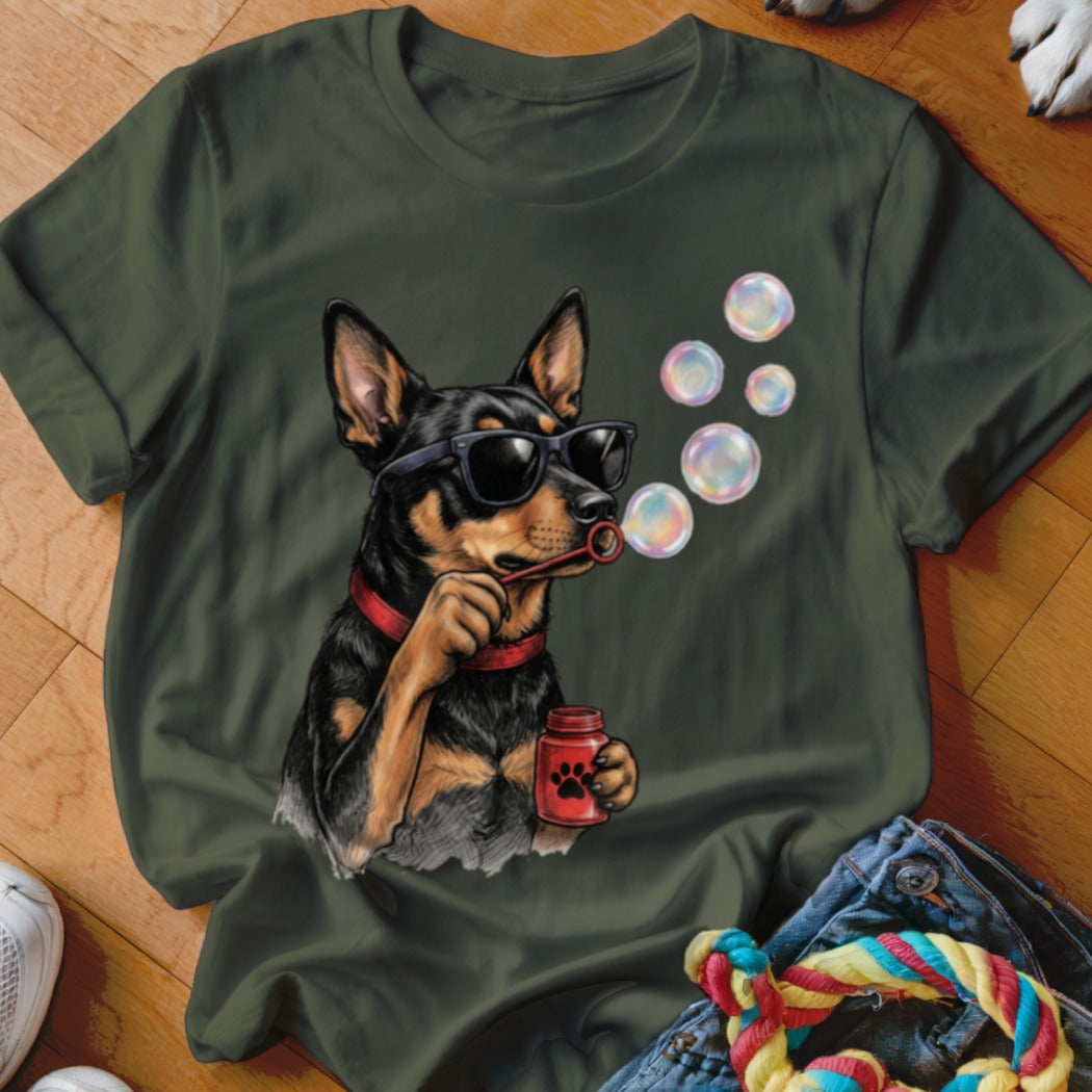 A dark green t-shirt features a graphic of a dog wearing sunglasses and blowing soap bubbles.