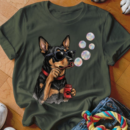 A dark green t-shirt features a graphic of a dog wearing sunglasses and blowing soap bubbles.