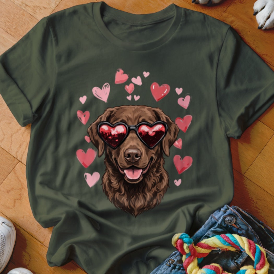 Dark green t-shirt featuring a graphic of a brown dog wearing heart-shaped sunglasses surrounded by pink hearts.