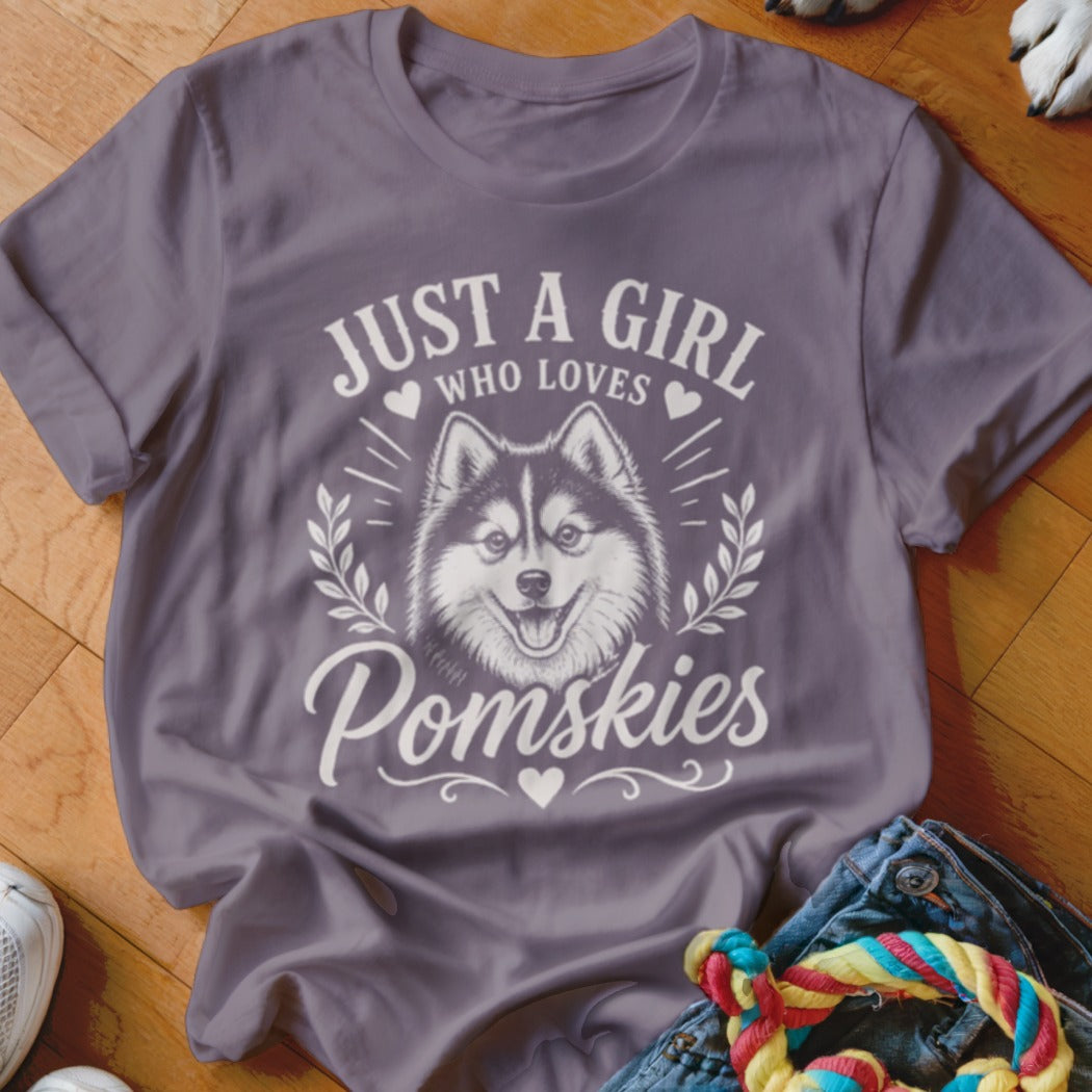 Purple t-shirt with "Just a girl who loves Pomskies" and a Pomsky dog illustration.