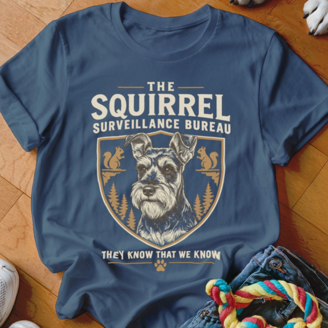 Dark blue t-shirt featuring a graphic with a Schnauzer and text reading The Squirrel Surveillance Bureau.