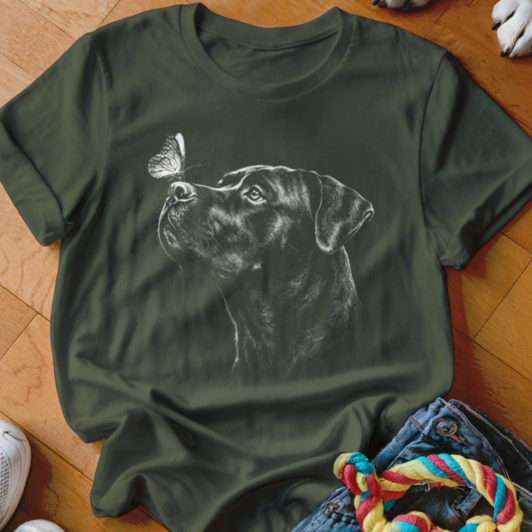 Dark green t-shirt featuring a white sketch graphic of a Rottweiler looking at a butterfly.