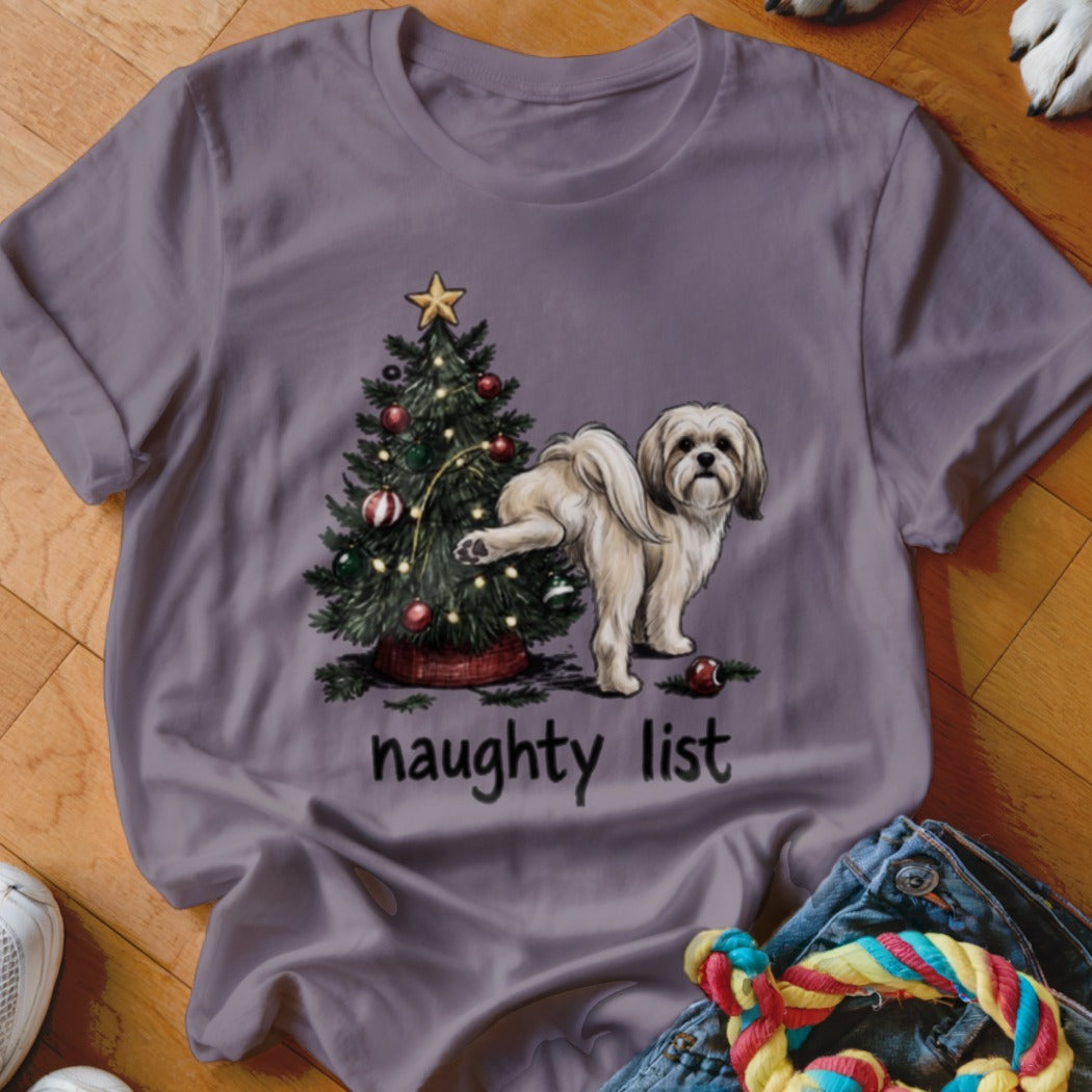 Shih Tzu dog near Christmas tree with text "naughty list"