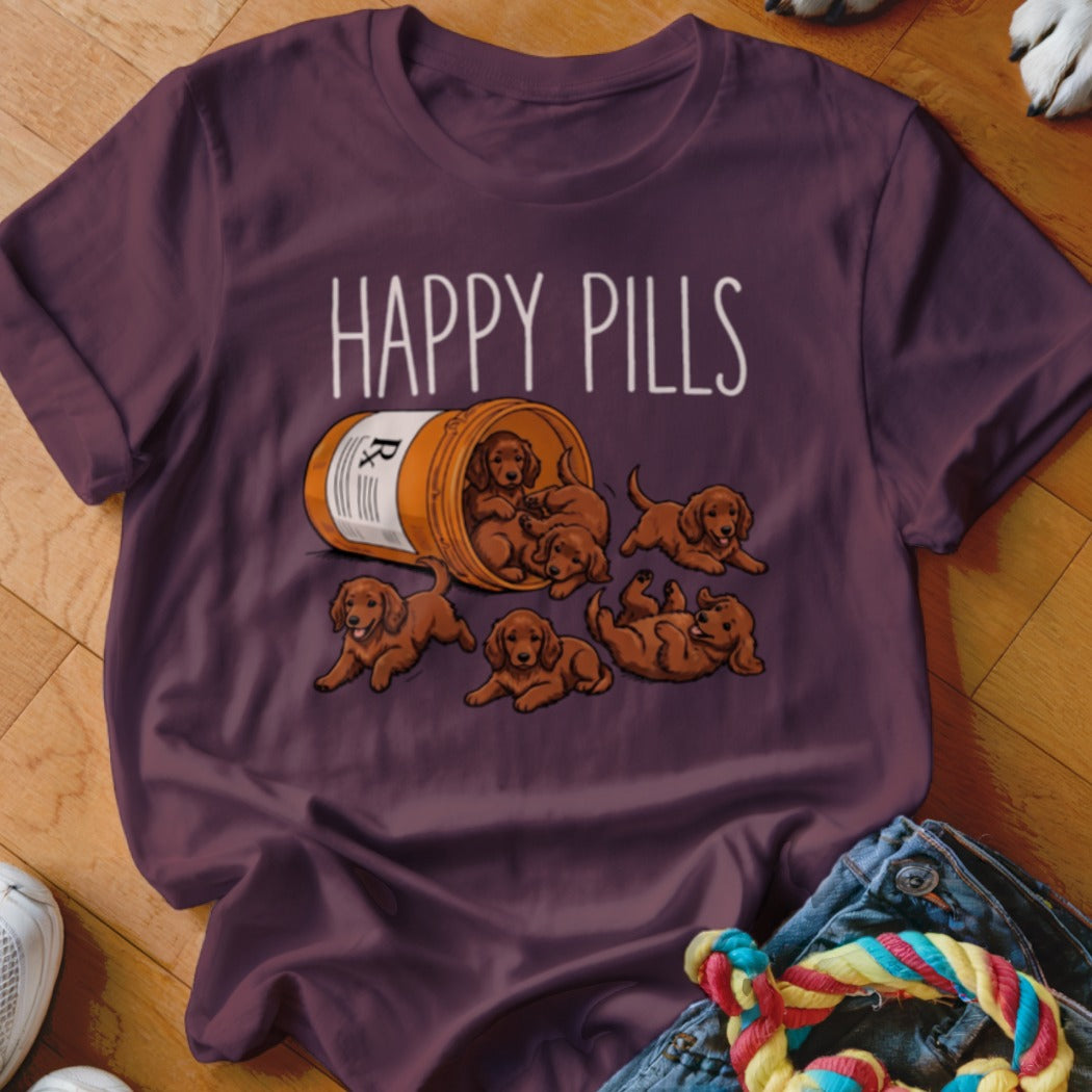 T-shirt with "Happy Pills" text and a pill bottle overflowing with puppies.