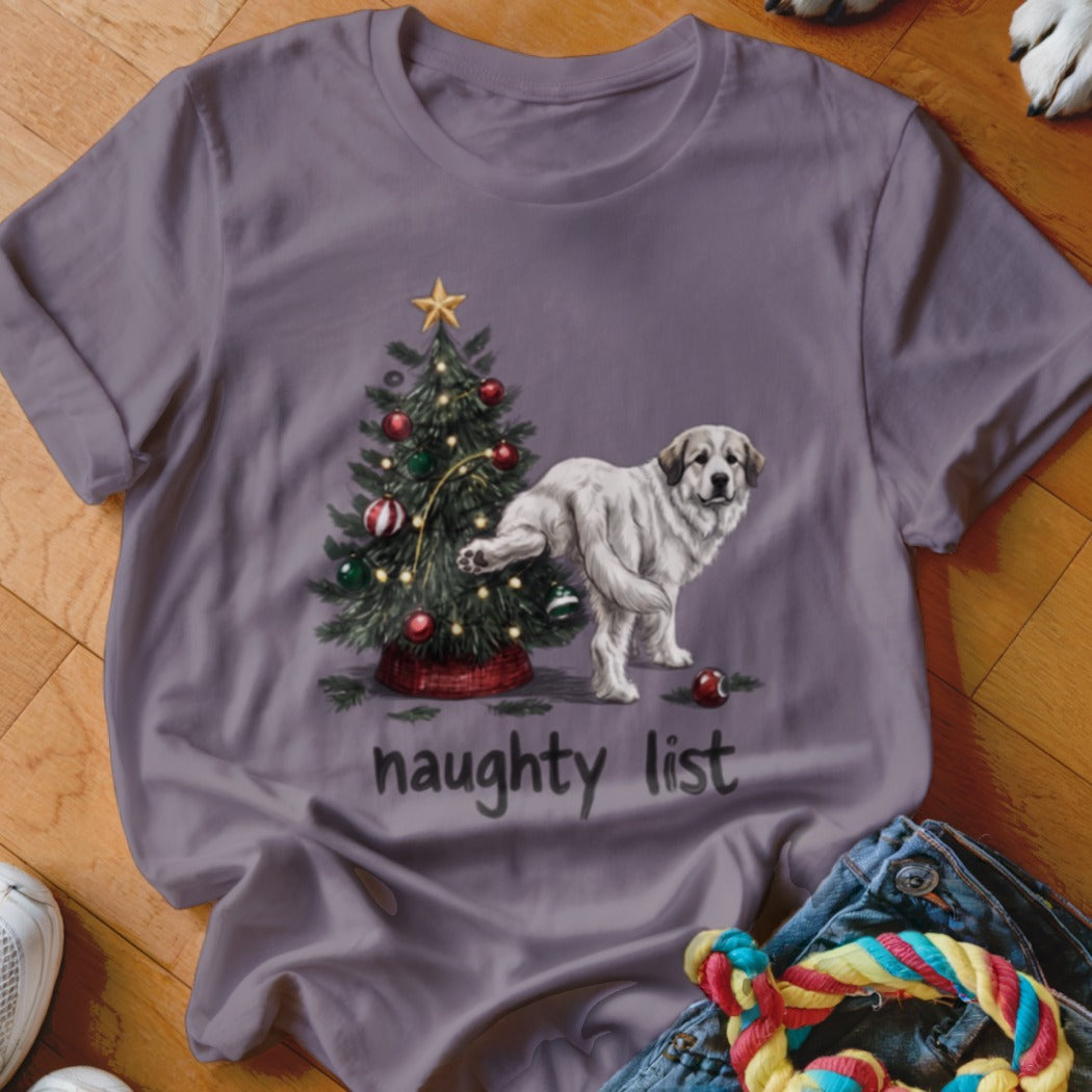 A purple t-shirt featuring a cartoon dog peeing on a decorated Christmas tree above the text naughty list.
