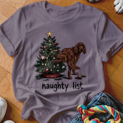 Brown Irish Setter peeing on Christmas tree, text reads "naughty list".