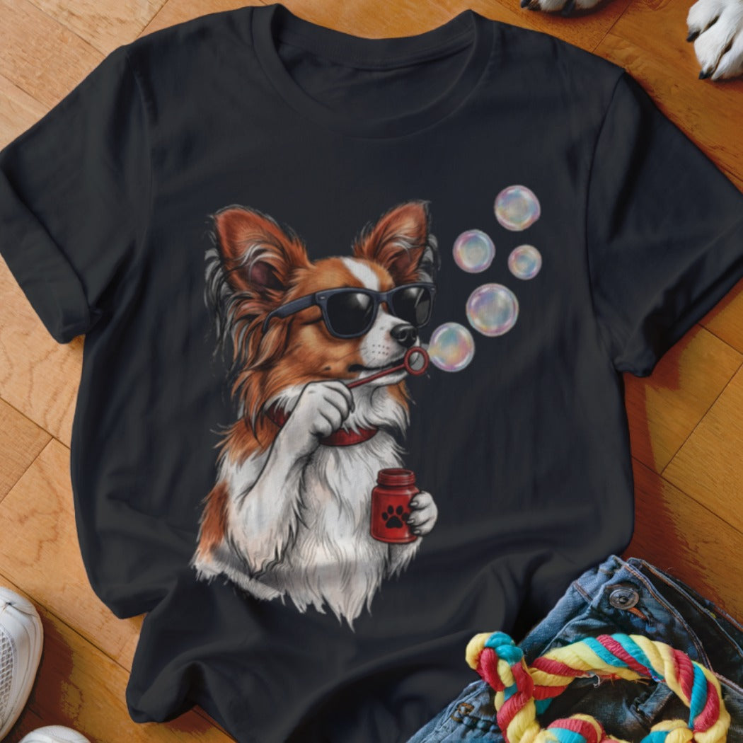 Black t-shirt featuring a graphic of a brown and white dog wearing sunglasses and blowing bubbles.
