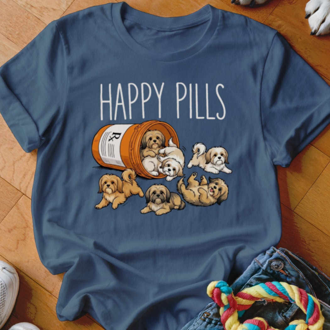 Shih Tzus spill out of a prescription bottle labeled "HAPPY PILLS" on a blue t-shirt.