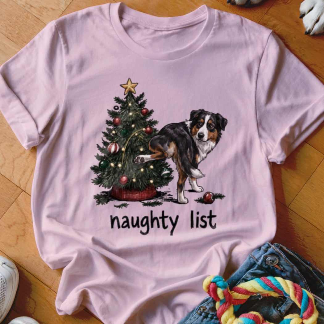 T-shirt with Australian Shepherd dog near Christmas tree, text "naughty list".