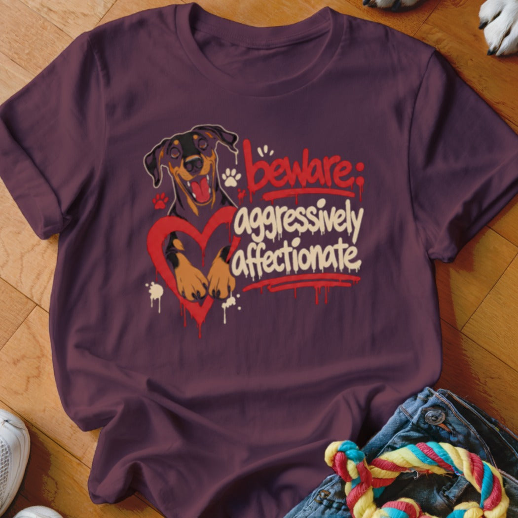 T-shirt with a Doberman inside a red heart and text "Beware: aggressively affectionate".