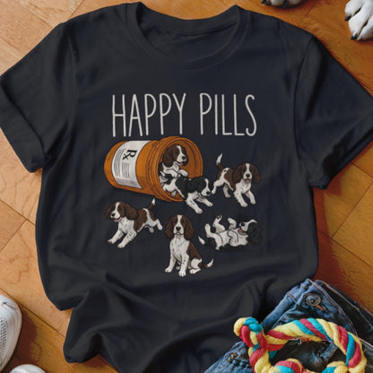 T-shirt with "HAPPY PILLS" text and Springer Spaniel puppies spilling from a prescription bottle.