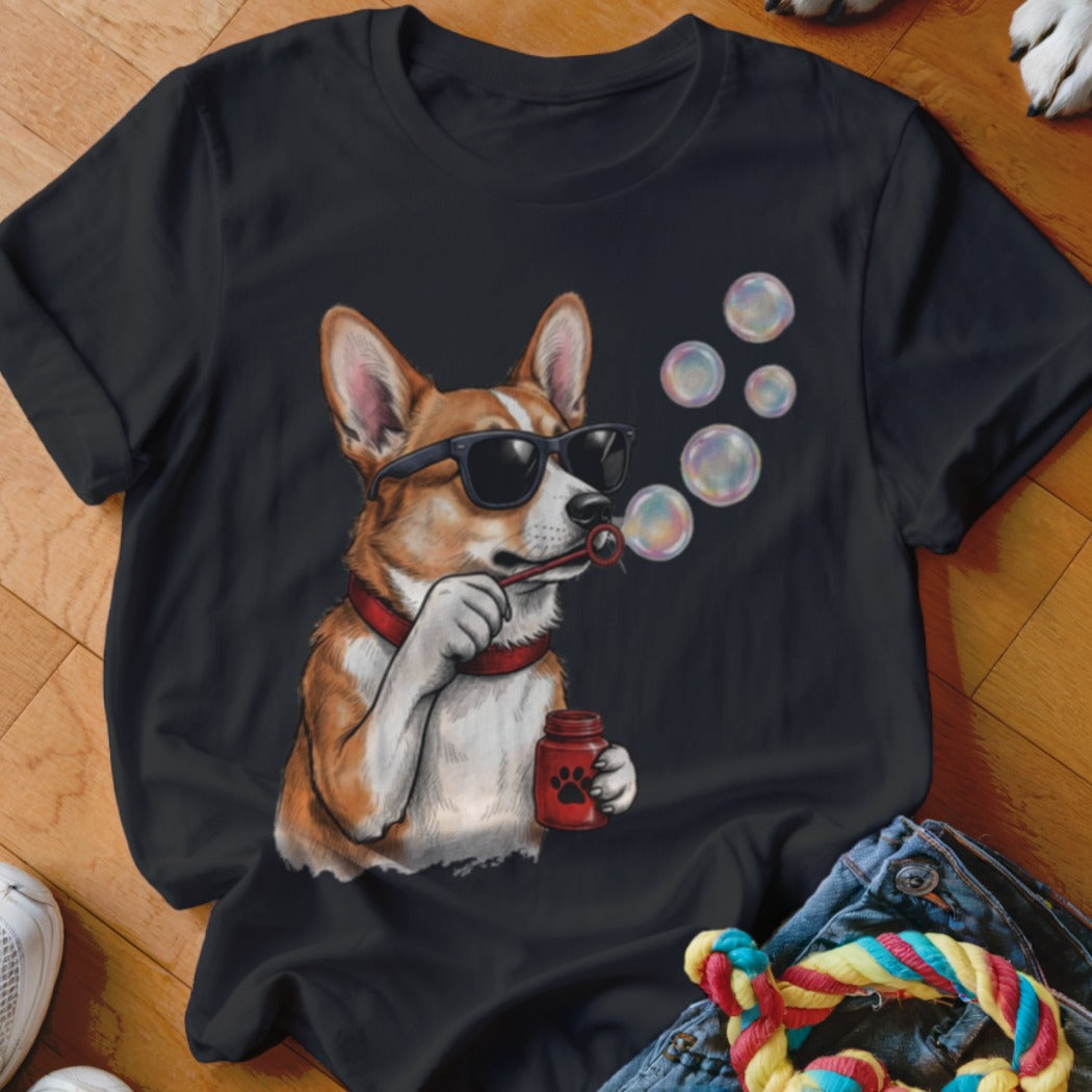 Black t-shirt featuring an illustration of a corgi wearing sunglasses and blowing soap bubbles.