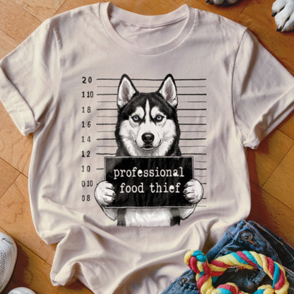 Husky mugshot with text "professional food thief"