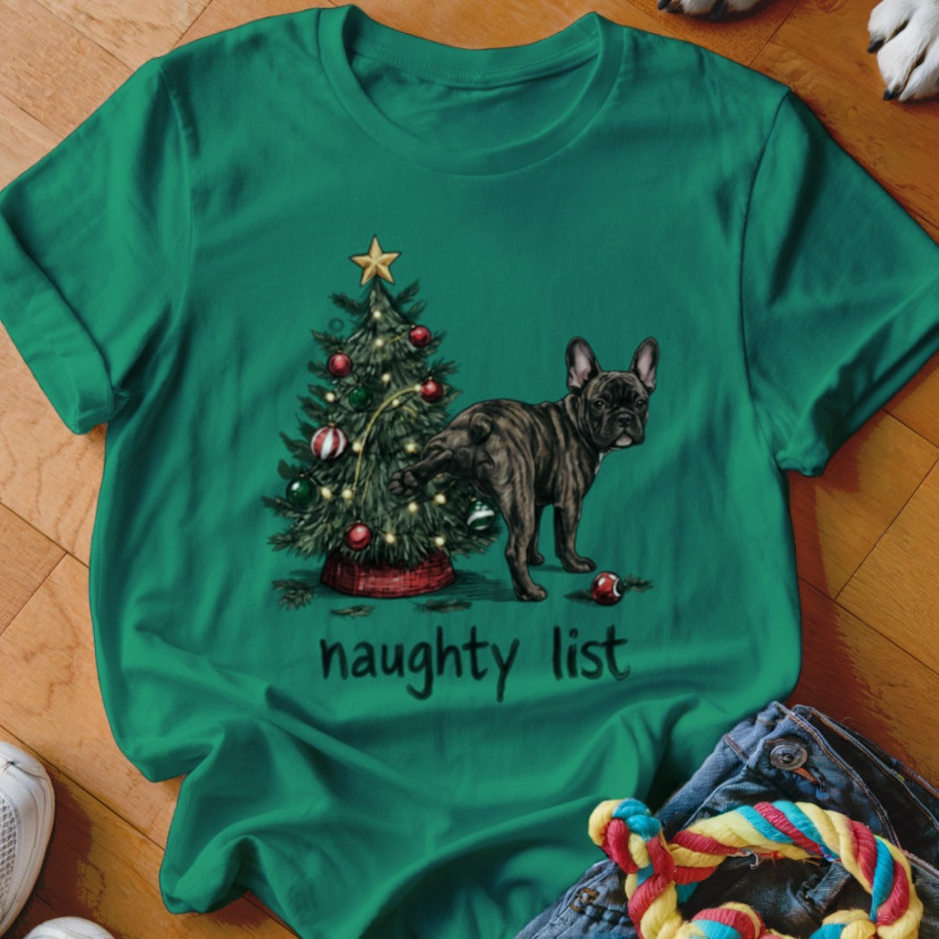 A green t-shirt features a graphic of a French bulldog lifting its leg near a decorated Christmas tree with the text "naughty list".