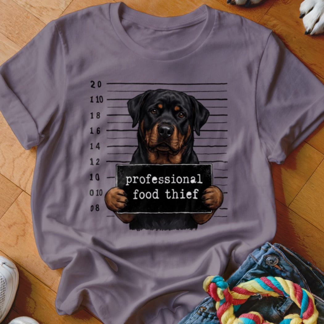 Rottweiler mugshot graphic on t-shirt reads "professional food thief."