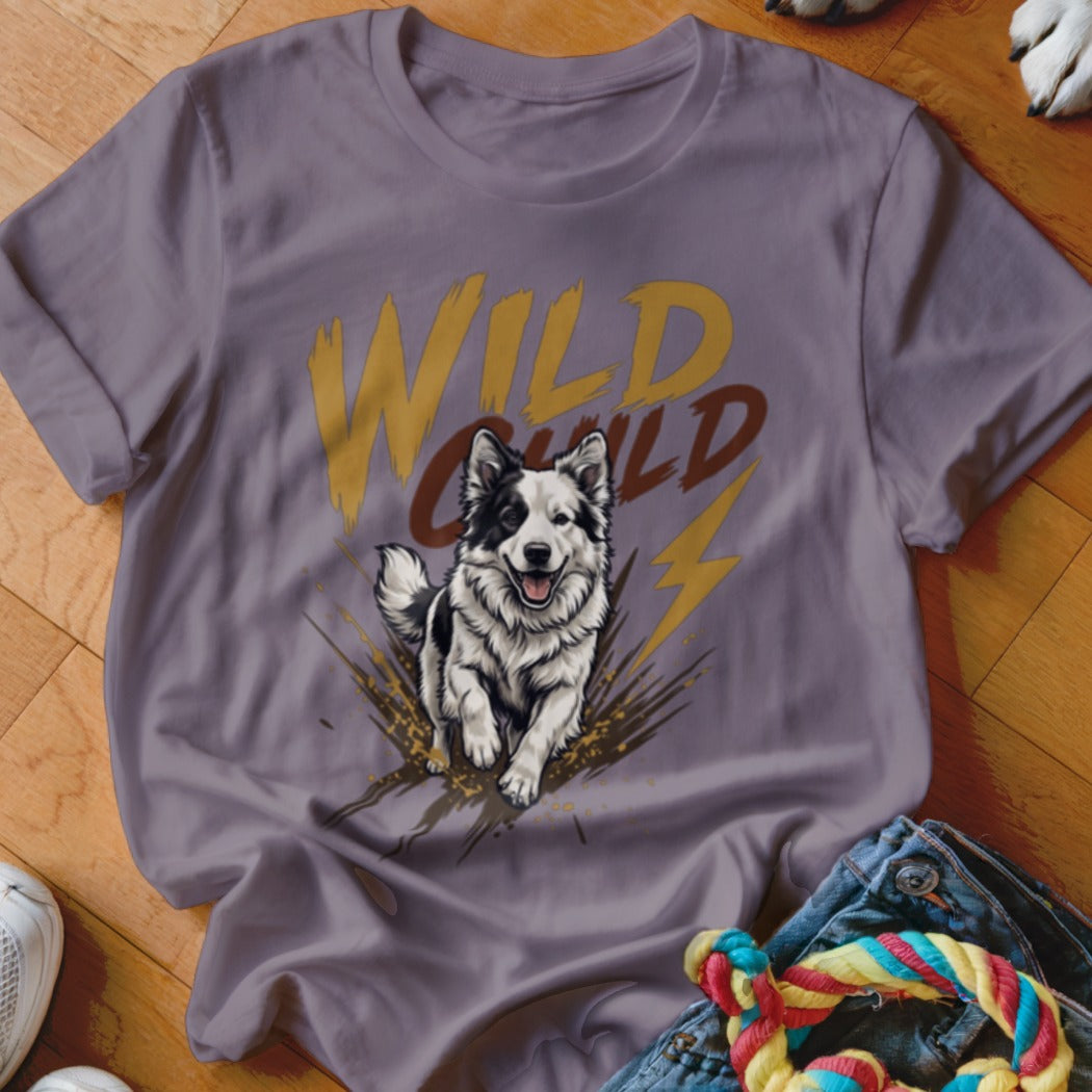 A purple t-shirt featuring a graphic of a black and white dog running with the text Wild Child.